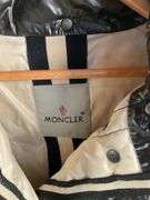 Moncler Black Shiny Quilted Jacket With Embroidered Logo and Comic Strip Instructions
