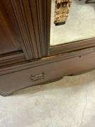 Wooden Armoire with Beveled Mirror and Carved Details