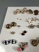 Assorted Costume Jewelry Lot Featuring Earrings, Charms, and Pendants