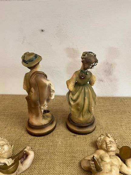 Four Chalkware Figurines Including Boy, Girl, and Two Reclining Cherubs
