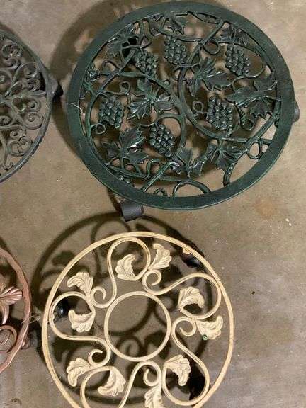 Four Decorative Metal Plant Stands on Wheels
