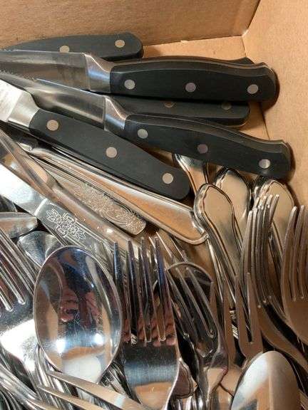 Large Assortment of Stainless Steel Flatware and Knives
