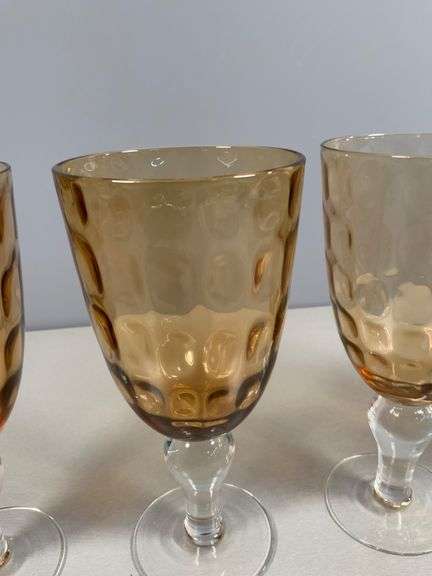 Four Amber-Colored Goblets with Clear Stems