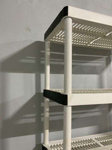 White Plastic Tiered Shelving Unit With Black Accents