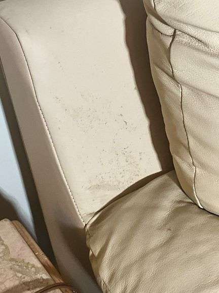 Cream-Colored Leather Sofa with Padded Armrests