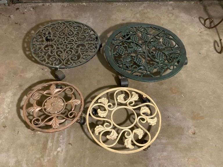 Four Decorative Metal Plant Stands on Wheels