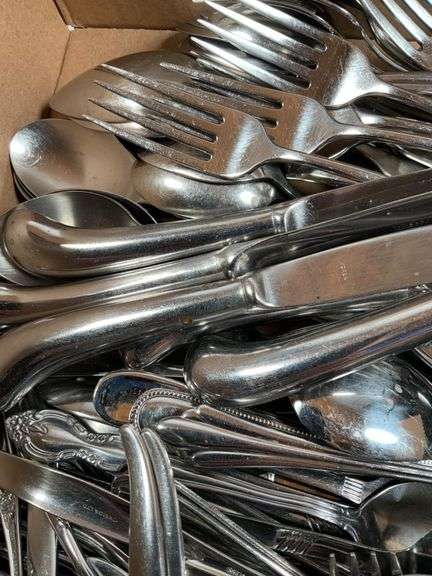 Large Assortment of Stainless Steel Flatware and Knives