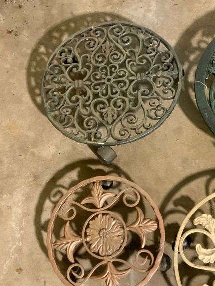 Four Decorative Metal Plant Stands on Wheels