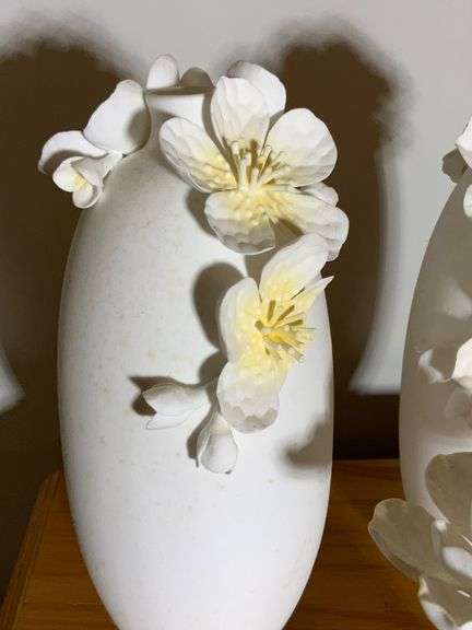 Three White Ceramic Vases with Applied Floral Detailing