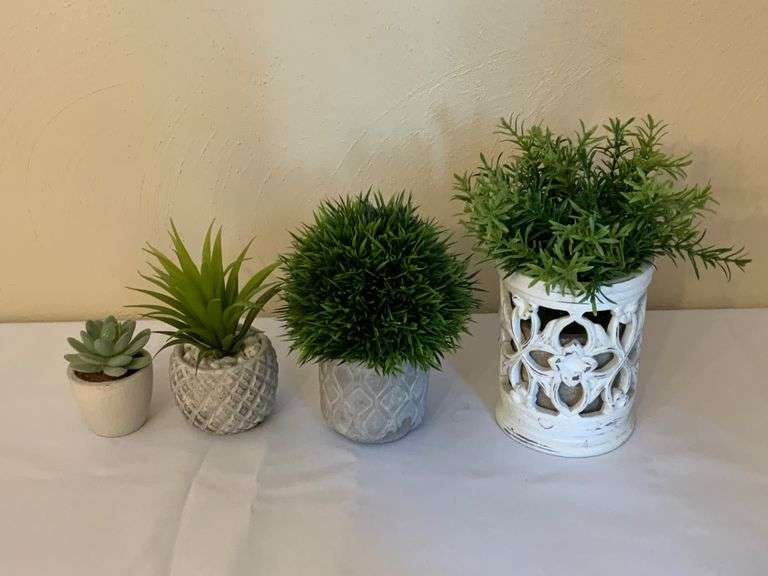 Four Small Artificial Plants in Decorative Pots