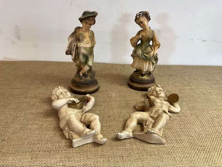 Four Chalkware Figurines Including Boy, Girl, and Two Reclining Cherubs