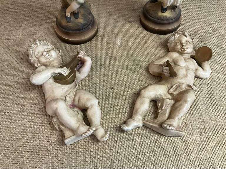 Four Chalkware Figurines Including Boy, Girl, and Two Reclining Cherubs