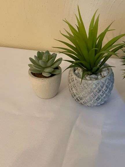 Four Small Artificial Plants in Decorative Pots