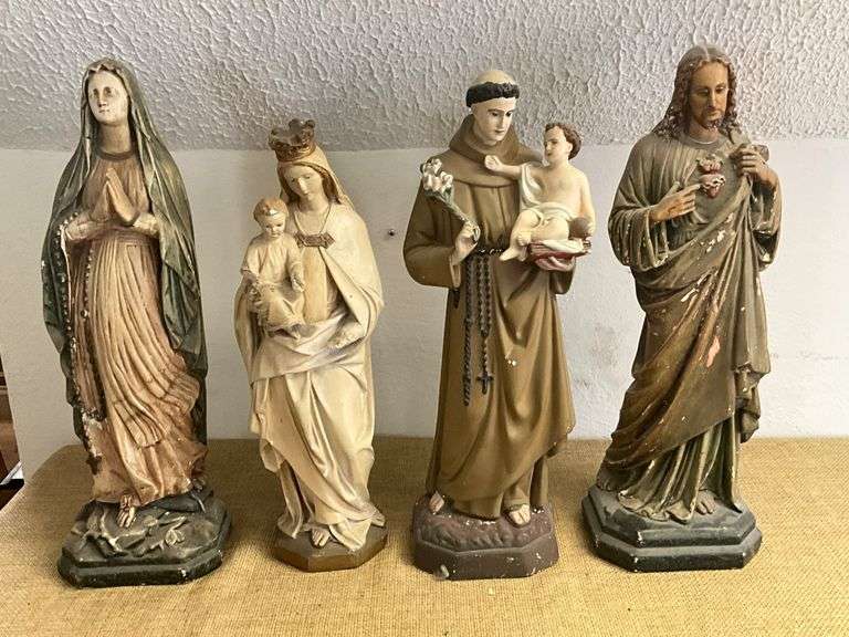 Four Religious Figurines Featuring Virgin Mary, Jesus, and Saints