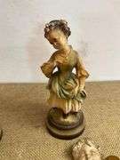 Four Chalkware Figurines Including Boy, Girl, and Two Reclining Cherubs