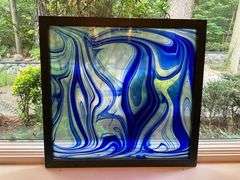 Framed Blue and White Swirled Stained Glass Panel