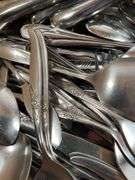 Large Assortment of Stainless Steel Flatware and Knives