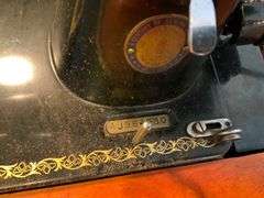 Singer Sewing Machine with Wooden Cabinet