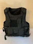 Black Tactical Vest with Adjustable Straps and Multiple Pouches
