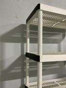 White Plastic Tiered Shelving Unit With Black Accents