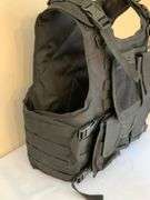 Black Tactical Vest with Adjustable Straps and Multiple Pouches