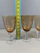 Four Amber-Colored Goblets with Clear Stems