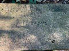 Concrete Outdoor Bench with ‘Do Drop In’ Inscription