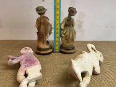 Four Chalkware Figurines Including Boy, Girl, and Two Reclining Cherubs
