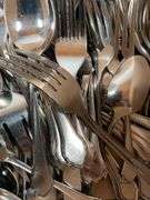 Large Assortment of Stainless Steel Flatware and Knives