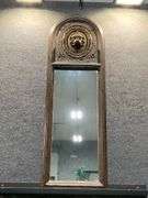 Arched Wooden Wall Mirror with Carved Lion Head Detail