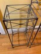 Two Metal and Glass Pedestal Tables
