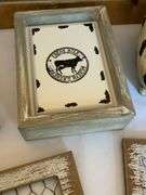 Farmhouse-Style Decor With Pig Artwork and Embellishments