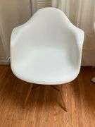 White Molded Chair with Wooden Legs and Metal Supports
