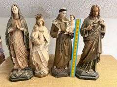Four Religious Figurines Featuring Virgin Mary, Jesus, and Saints