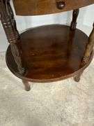 Three-Tier Wooden Side Table With Drawer and Turned Leg Design