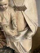 Four Religious Figurines Featuring Virgin Mary, Jesus, and Saints