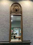 Arched Wooden Wall Mirror with Carved Lion Head Detail