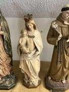 Four Religious Figurines Featuring Virgin Mary, Jesus, and Saints