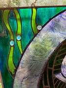 Stained Glass Panel Featuring Fish Design with Green and Blue Accents