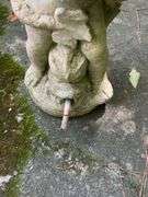 Concrete Figure Holding Seashell