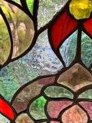 Stained Glass Panel With Floral and Geometric Design