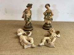 Four Chalkware Figurines Including Boy, Girl, and Two Reclining Cherubs