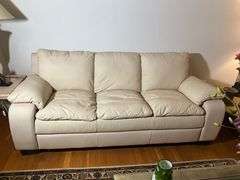 Cream-Colored Leather Sofa with Padded Armrests
