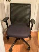 Black Mesh Office Chair With Padded Seat and Adjustable Features