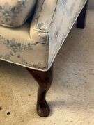 Upholstered Loveseat with Floral Pattern and Wood Legs