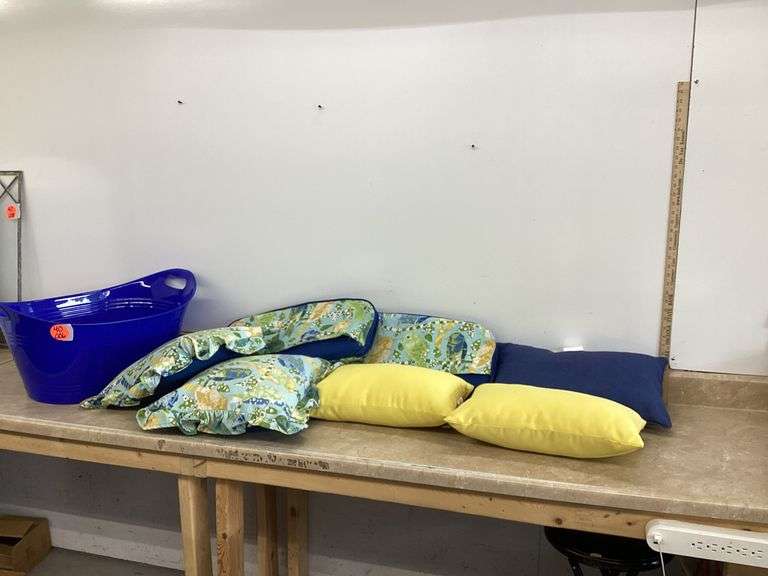 PATIO PILLOWS IN PLASTIC BASKET