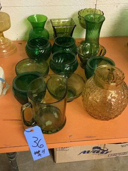 14 pieces of green glass with pitchers