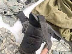 Four tactical vests, duffelbag and drop leg holster