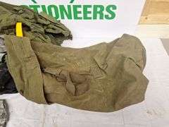 Four tactical vests, duffelbag and drop leg holster