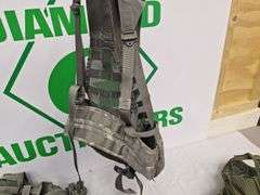 Four tactical vests, duffelbag and drop leg holster